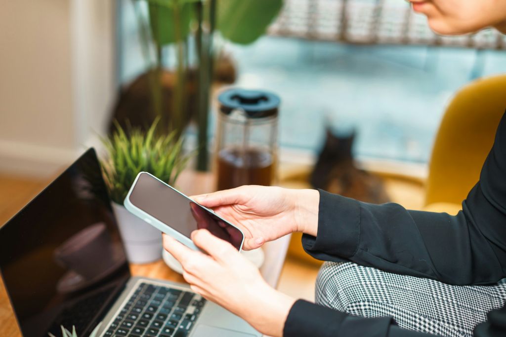 A person managing a fundraising campaign on a smartphone