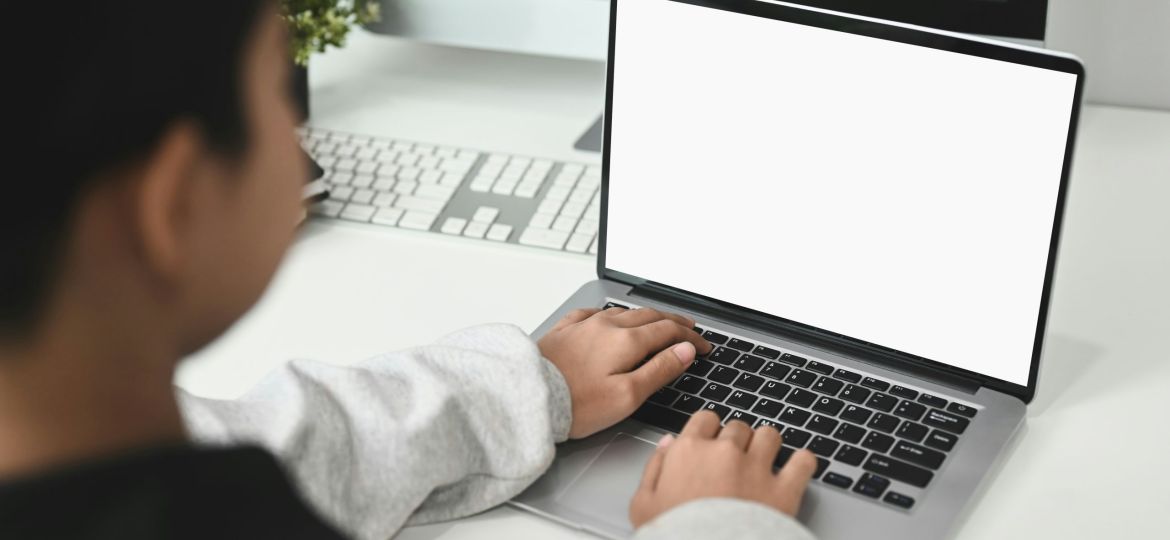 A person using a laptop while practicing responsible crowdfunding.
