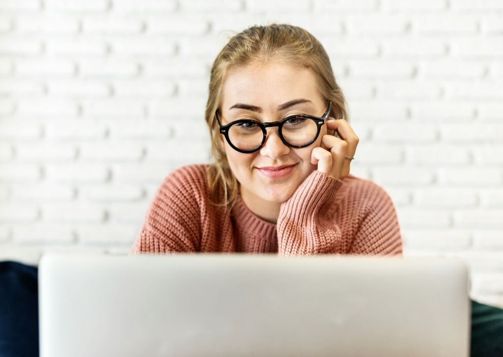 Introvert working on a travel fundraising campaign on a laptop