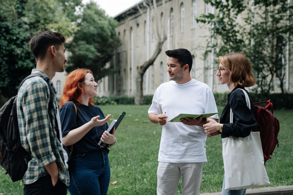 A group of friends talking about Volunteer Program