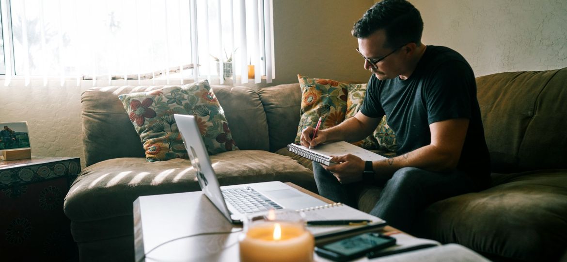 An introvert planning a travel fundraising campaign at home