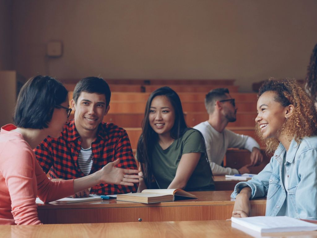 A group of friends smiling and chatting 
