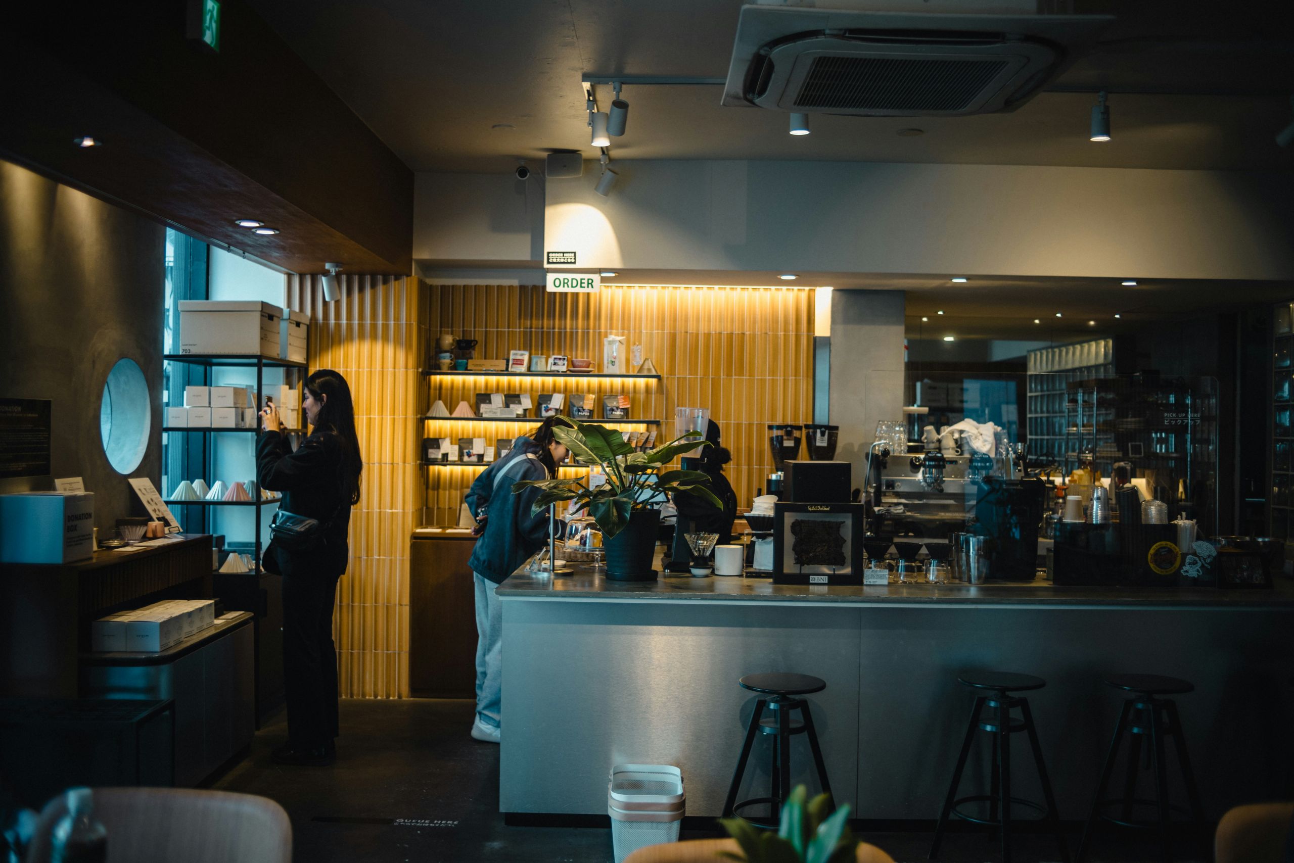Customers ordering in modern cafe