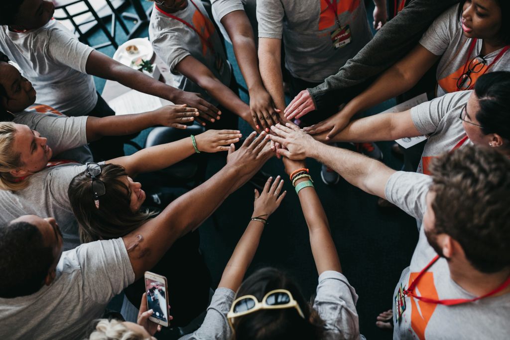 Team hands together for a cause