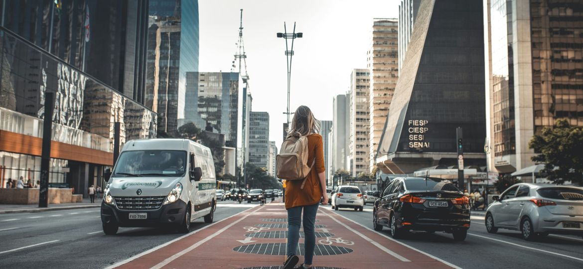 Woman with backpack in city