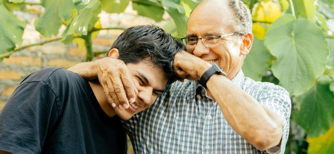 Father and son laughing.